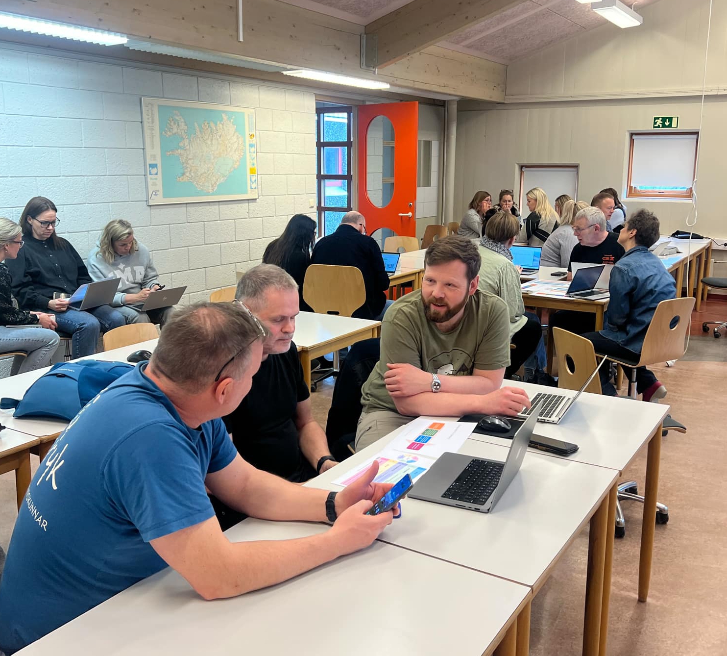 Teachers sitting in a group during an AI workshop
